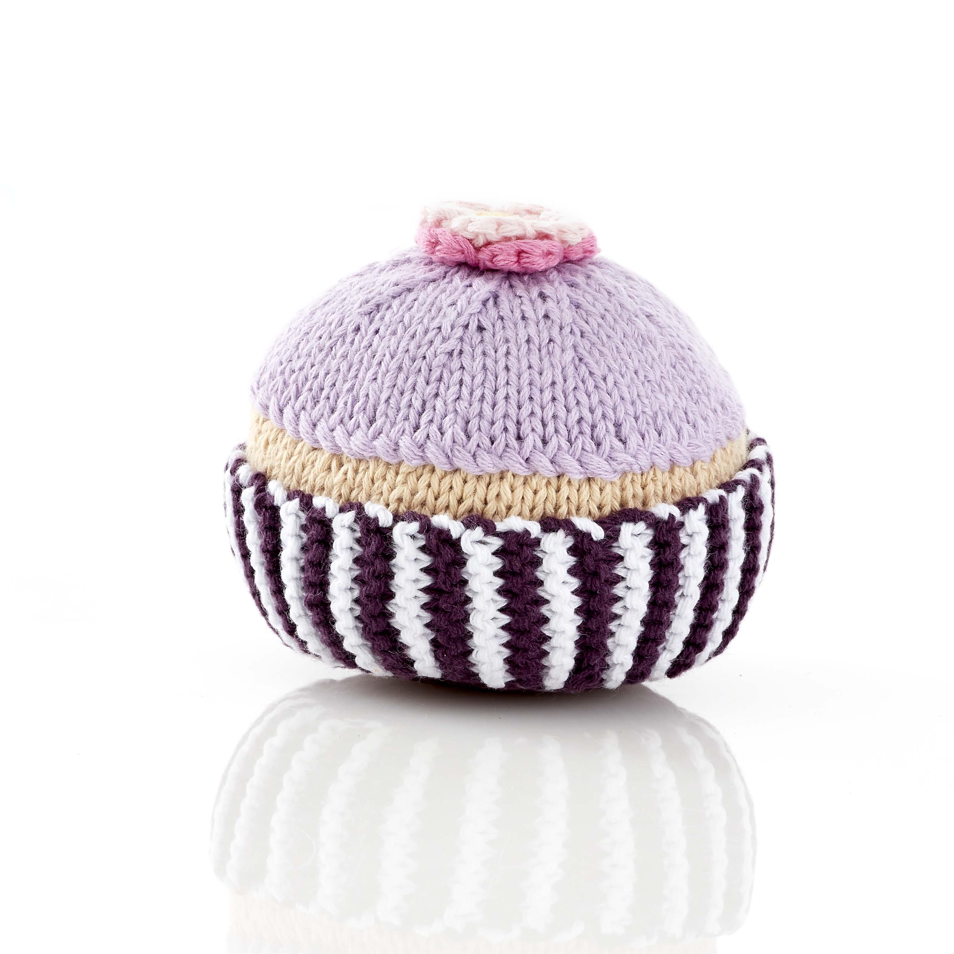 pretty pink cupcake baby rattle with purple icing and flower on top